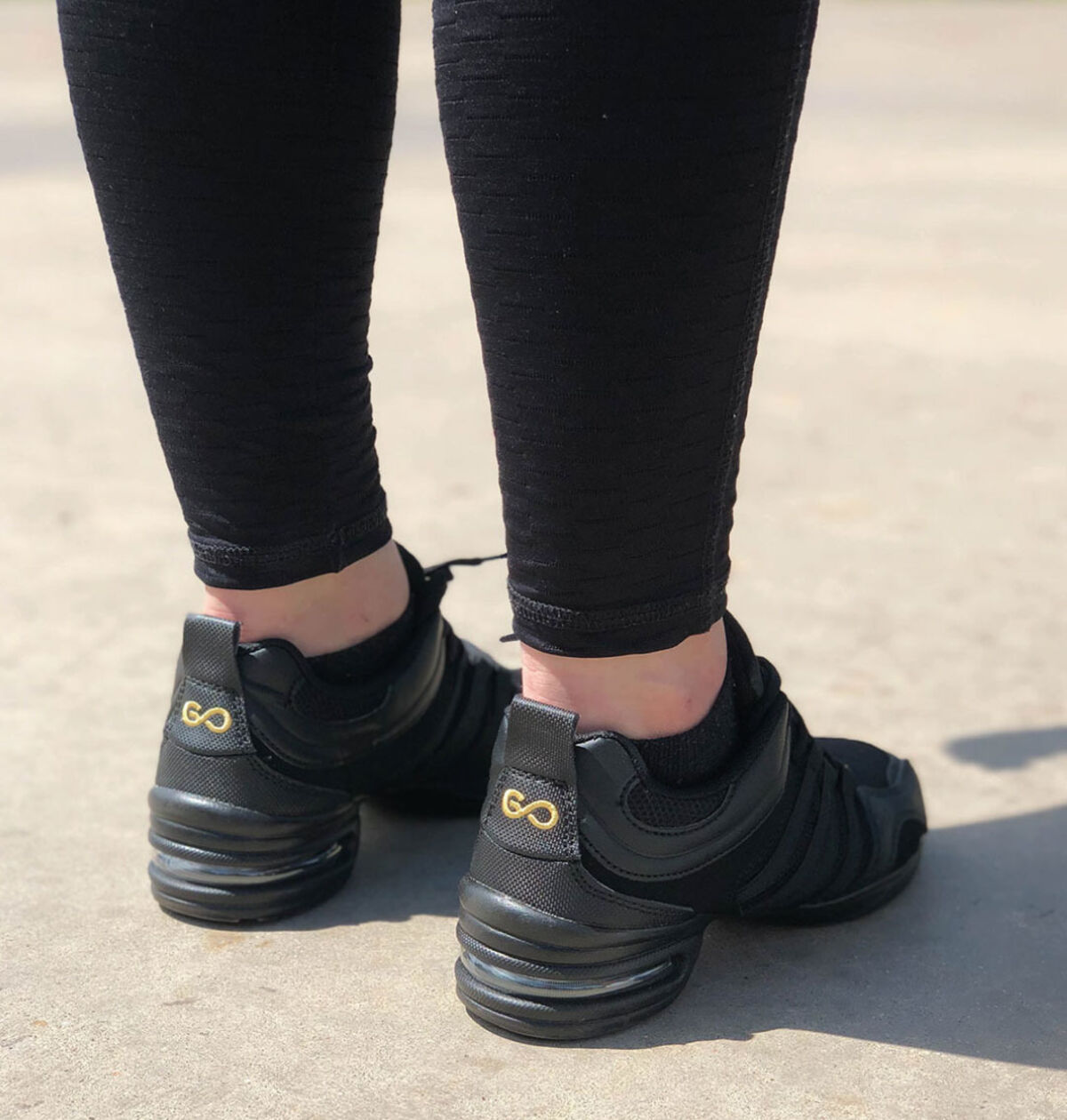 Go Dance black dance sneakers worn outdoors